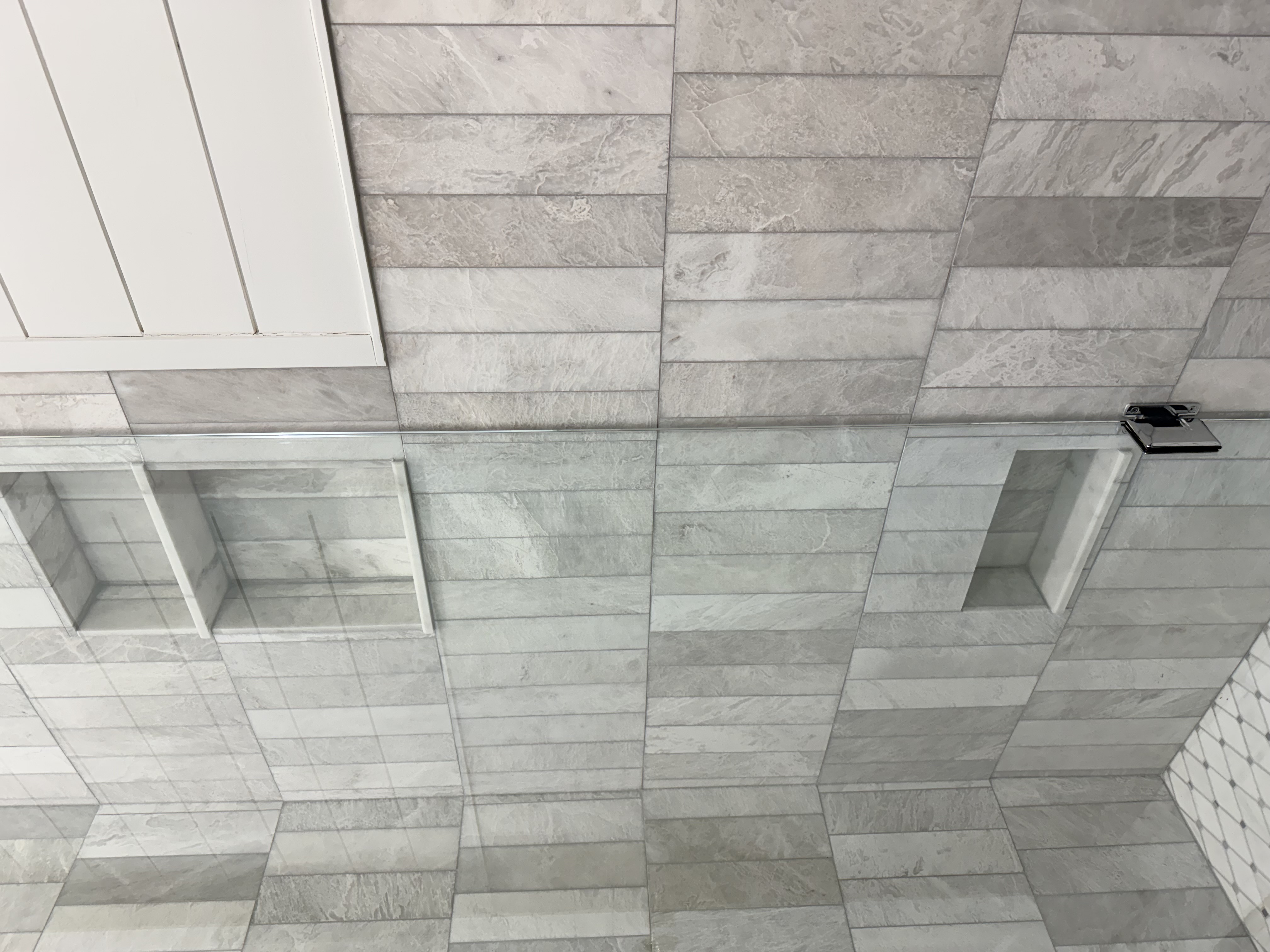 Shower tile detail with gray stone-plank tile and built-in niche, Tampa Bay FL